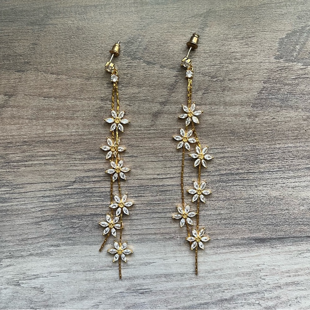 Gold and white diamond daisy dangle earrings
